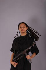 Fototapeta premium Pretty curly woman with vintage german submachine gun
