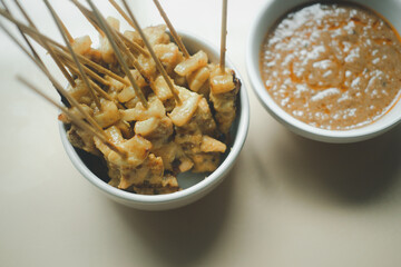 Pork satay with sweet peanut sauce.