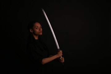 Beautiful woman holding a katana sword