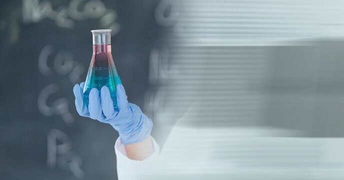 Composition Of Scientist Holding Beaker With Blue Liquid Working In Laboratory And Copy Space