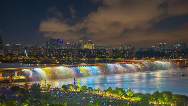 top view han river and Banpo bridge rainbow fountain show at night in Seoul, South Korea.