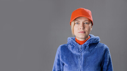 Female factory worker or truck driver over grey background
