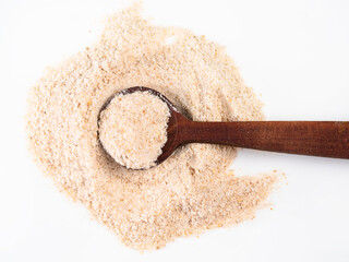 spoon on pile of ground asafoetida on white