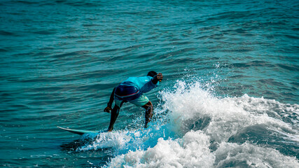 Extreme Sports and Highspeed Action Photography - Picture of Surfer Man Surfing On Blue Ocean Wave,...