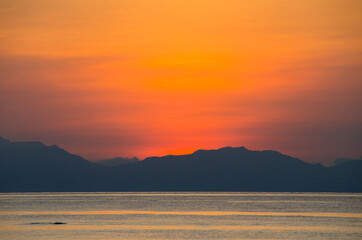 Silhouette island and sea sunrise time. Thailand.