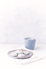 White chocolate cookies and Cappuccino on bright wooden background. Copy space.	