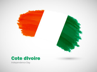 Happy independence day of Cote dIvoire with artistic watercolor country flag background. Grunge brush flag illustration