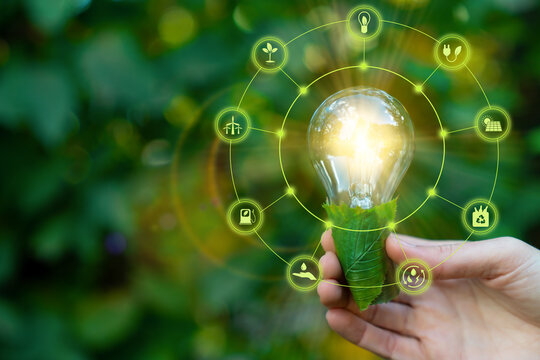 Green energy innovation light bulb with future industry of power generation icon graphic interface. Concept of sustainability development by alternative sources renewable. Ecology and environment.