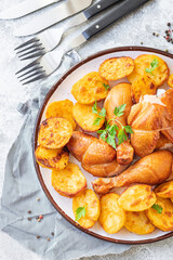 chicken and potatoes fried meat, baked vegetables baked poultry pieces organic, wholesome dish on the table healthy food meal snack copy space food background rustic. top view