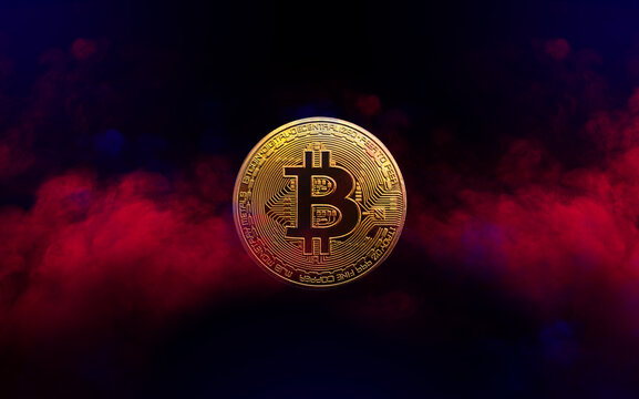 golden bitcoin coin is in red and blue smoke background. cryptocurrency concept