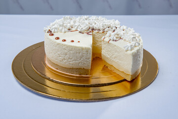 Round white cake on the special mirror stand