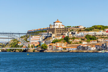Fototapeta na wymiar A historic and modern architecture of Vila Nova de Gaia over Douro River, Portugal