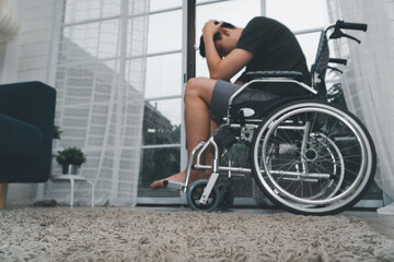 A disabled man sitting in a wheelchair is disappointed and Desperate to heal after car accident....