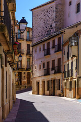 Street of an old town with stone houses and narrow alley. Sepulveda Segovia.