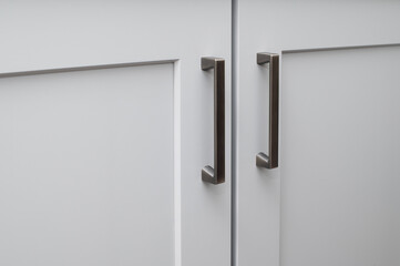 Handles on the doors of the kitchen cabinet