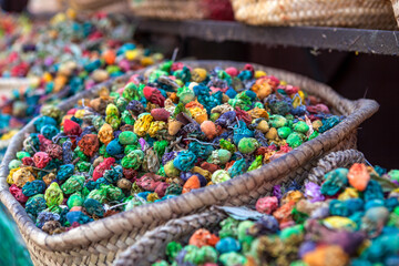 Colourful Moroccan spices, herbs  and dried flowers on a market in Marrakesh - Central Morocco