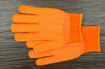 Work gloves on wooden background