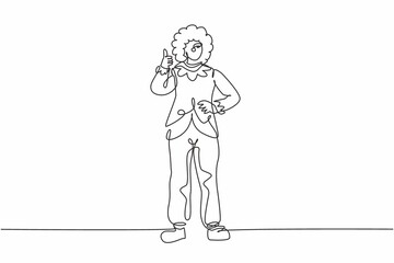 Single one line drawing of female clown stands with a thumbs-up gesture wearing wig and clown costume ready to entertain the audience in circus. Continuous line draw design graphic vector illustration