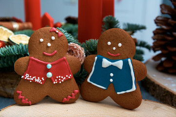 Christmas gingerbread in the shape of merry men. Christmas tree in the background