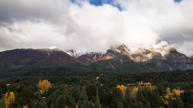 A mountain of clouds runs along Lopez Hill in Bariloche, Argentina during autumn. Hyperlapse drone.