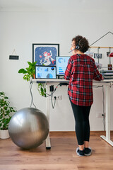 Woman telecommuting at an adjustable standing desk