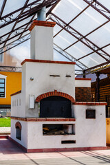 Traditional Russian oven, outdoors under a canopy. The picture was taken in Russia, in the city of...