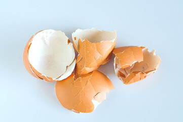 Eggshell scattered from egg boiled on a white background.