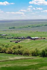 Agricultural farm among the spring fields. Photo taken near the village of Voskresenovka, Orenburg region, Russia
