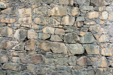 Backgrounds of the old fortress wall. Background of vintage stone wall