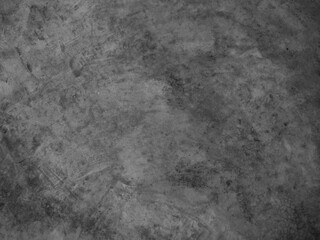 Fototapeta na wymiar Black and white background image, rough surface, looks like a cement floor.