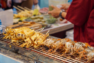 Grilled squid on a charcoal grill