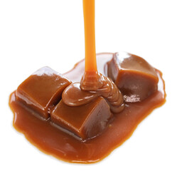 pouring homemade caramel sauce on caramel candies
