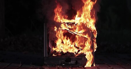 TV burning with broken screen - Powered by Adobe