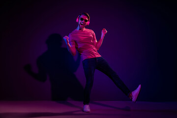 Full length body size view of attractive cheerful carefree guy listening sound dancing isolated...