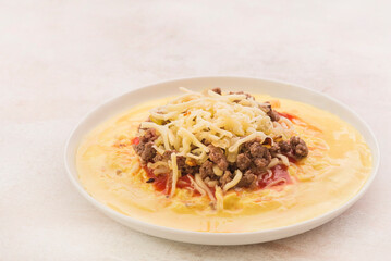 Polenta with tomato, cheese and mince