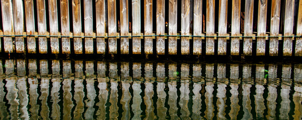 wooden embankment and reflections