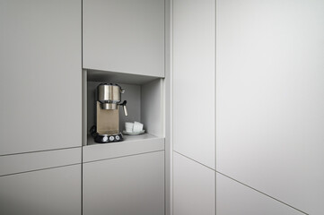 Modern gray kitchen corner with espresso coffee machine