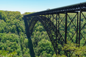Truck passing over the New River Gorge Bridge shows perspective