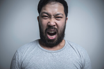 Asian handsome man angry on white background,Portrait of young Stress male concept