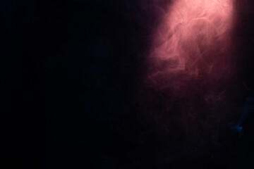 Blue and pink steam on a black background.
