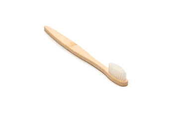 Bamboo toothbrush isolated on a white background.