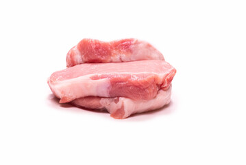 Raw pork pieces isolated on a white background.