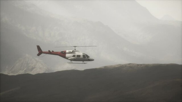 extreme slow motion flying helicopter near mountains with fog