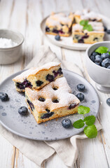 Delicious blueberry cake sprinkled with powdered sugar