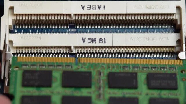Inserting RAM into a laptop connector, laptop repair and maintenance at home