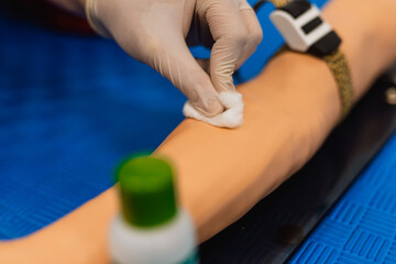 Close up Hand of nurse, doctor or Medical technologist in white gloves taking blood sample from a...