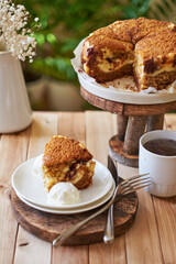 A piece of cake with cream cheese and chocolate. Side view.