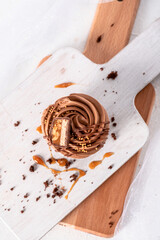 Chocolate cupcakes with decoration on white background