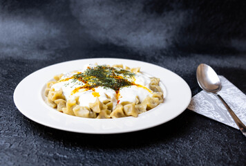 Traditional Turkish ravioli with yoghurt, butter and spices