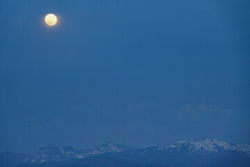 Full moon over Sierra Nevada (Spain) at dusk
